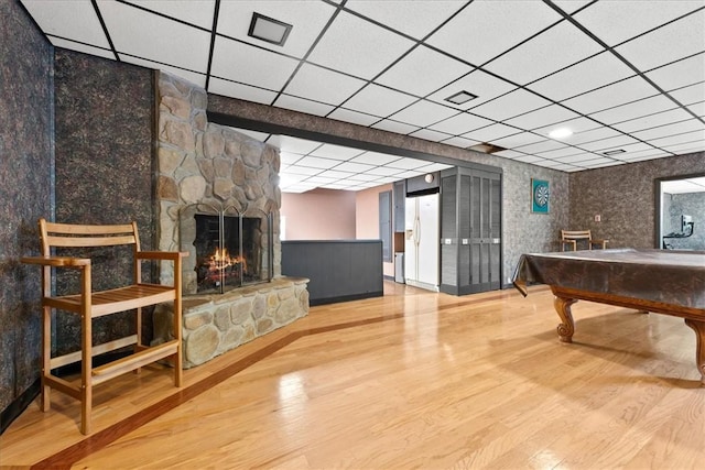 1122 Cox Rd, Anderson, SC 29621 - playroom featuring a paneled ceiling, wood finished floors, a wainscoted wall, a stone fireplace, and billiards