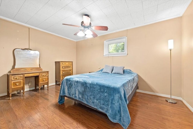 1122 Cox Rd, Anderson, SC 29621 - bedroom with crown molding, wood finished floors, baseboards, and a ceiling fan