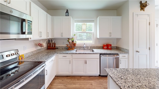 112 Queens Mill Ct, Pendleton, SC 29670 - kitchen with appliances with stainless steel finishes, a sink, and white cabinets