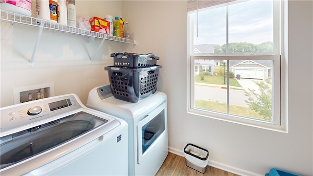112 Queens Mill Ct, Pendleton, SC 29670 - laundry area featuring separate washer and dryer, plenty of natural light, wood finished floors, and baseboards