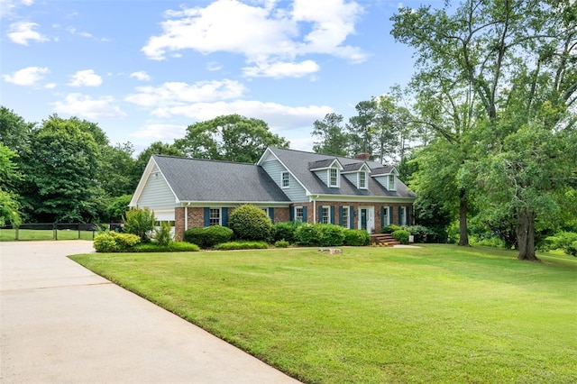 109 Cameron Way, Anderson, SC 29621 - cape cod-style house featuring brick siding, driveway, and a chimney