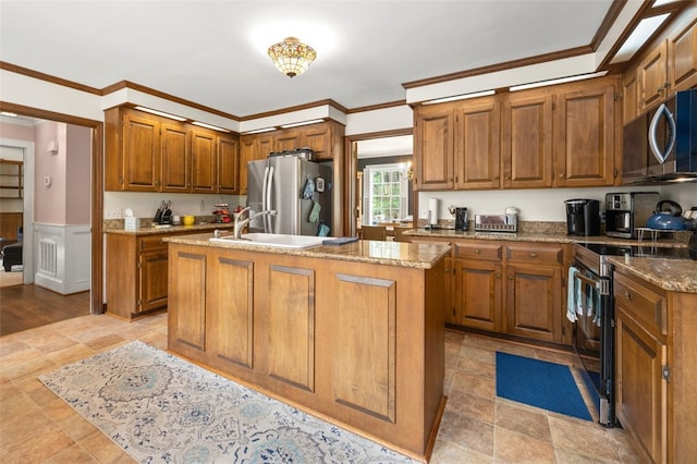 109 Cameron Way, Anderson, SC 29621 - kitchen with appliances with stainless steel finishes, a sink, brown cabinets, a kitchen island with sink, and light stone countertops