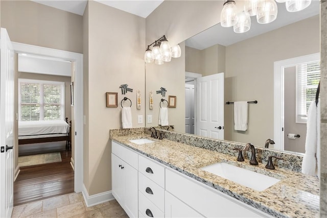803 Gate View Ct, Seneca, SC 29672 - bathroom with plenty of natural light, double vanity, baseboards, and a chandelier