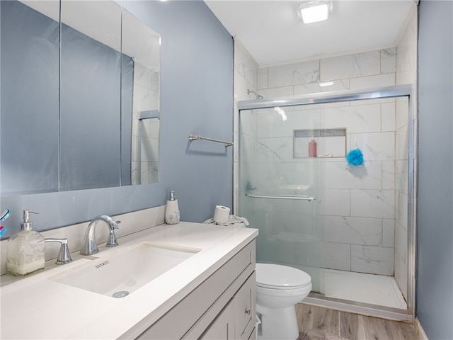 1225 Dogwood Ln, Clinton, SC 29325 - bathroom featuring toilet, vanity, a stall shower, and wood finished floors