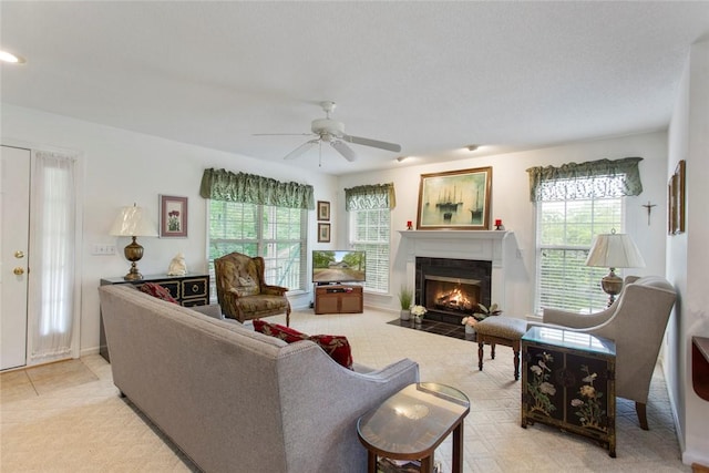 802 Pebble Ln, Anderson, SC 29621 - living room featuring plenty of natural light, a ceiling fan, a fireplace with flush hearth, and light tile patterned floors