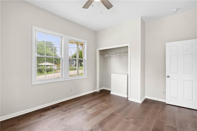 1316 E S 6th St, Seneca, SC 29678 - unfurnished bedroom with wood finished floors, baseboards, a closet, and ceiling fan