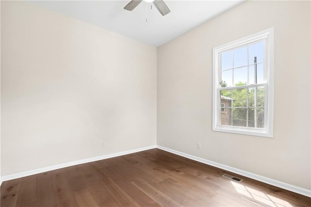 1316 E S 6th St, Seneca, SC 29678 - spare room with baseboards, a ceiling fan, and dark wood-style floors