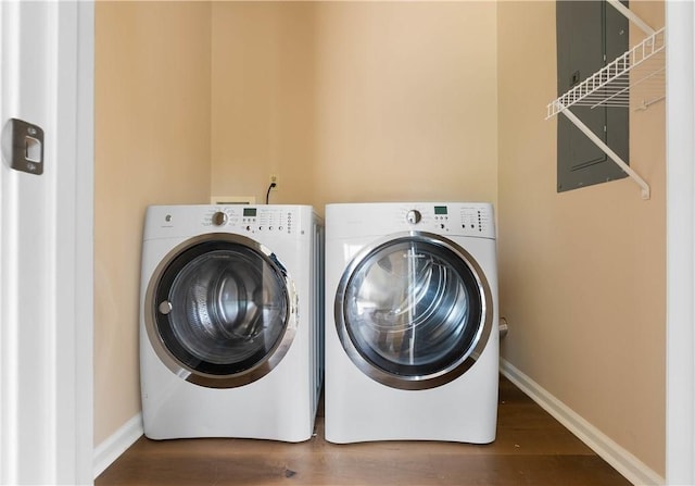 1316 E S 6th St, Seneca, SC 29678 - laundry area with washer and dryer, wood finished floors, and baseboards
