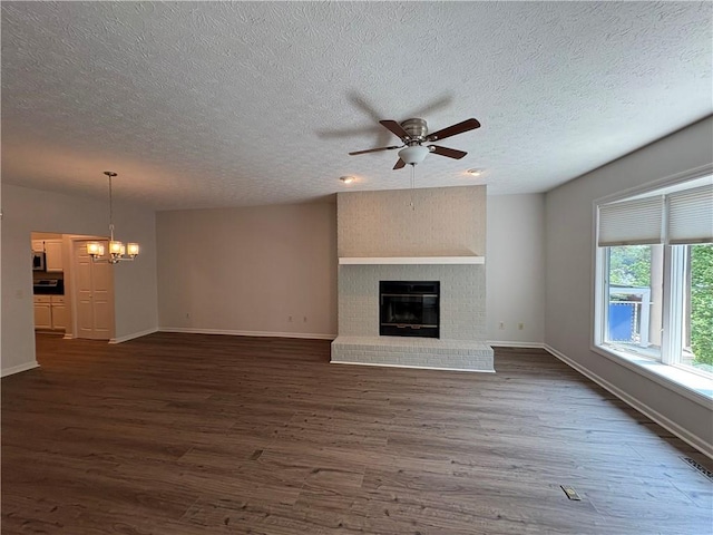 495 Tall Ship Dr Unit 340, Salem, SC 29676 - unfurnished living room featuring ceiling fan, dark wood-type flooring, a brick fireplace, and a textured ceiling