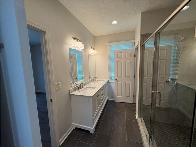 495 Tall Ship Dr Unit 340, Salem, SC 29676 - full bath with double vanity, a textured ceiling, baseboards, a stall shower, and tile patterned flooring