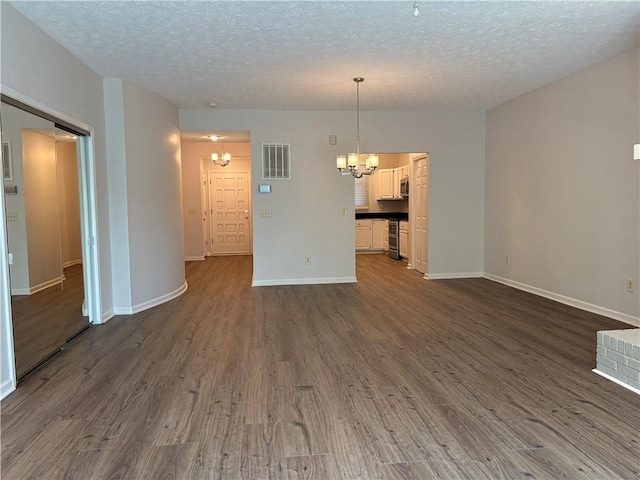 495 Tall Ship Dr Unit 340, Salem, SC 29676 - unfurnished room featuring a chandelier, a textured ceiling, dark wood finished floors, baseboards, and wine cooler