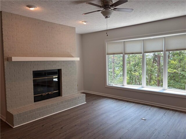 495 Tall Ship Dr Unit 340, Salem, SC 29676 - unfurnished living room featuring a ceiling fan, wood finished floors, baseboards, a textured ceiling, and a brick fireplace