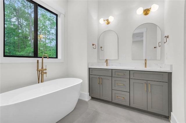 120 Thomason View Rd, Fountain Inn, SC 29644 - full bath featuring double vanity, a soaking tub, tile patterned flooring, and baseboards