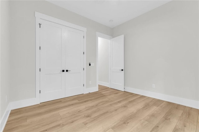 120 Thomason View Rd, Fountain Inn, SC 29644 - unfurnished bedroom with light wood-style floors, baseboards, and a closet