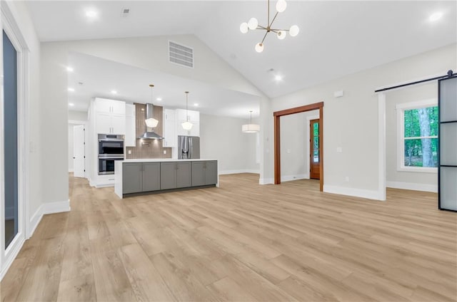 120 Thomason View Rd, Fountain Inn, SC 29644 - kitchen featuring appliances with stainless steel finishes, wall chimney range hood, white cabinetry, light countertops, and tasteful backsplash