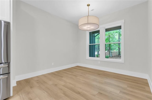 120 Thomason View Rd, Fountain Inn, SC 29644 - unfurnished dining area featuring light wood-type flooring and baseboards