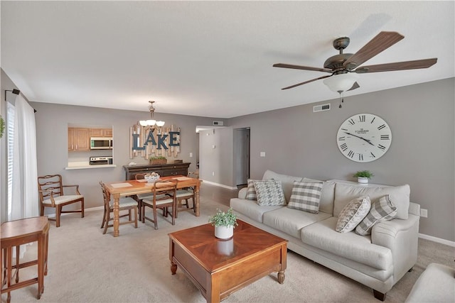 312 Northlake Dr, Anderson, SC 29625 - living area with a chandelier, a ceiling fan, and light colored carpet