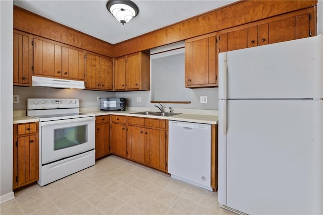 13036 W Camelia Ln, Seneca, SC 29678 - kitchen featuring white appliances, under cabinet range hood, a sink, and brown cabinetry