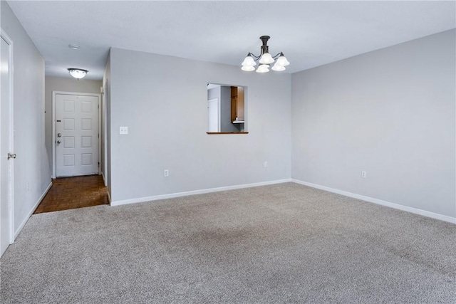 13036 W Camelia Ln, Seneca, SC 29678 - empty room featuring carpet floors, baseboards, and a chandelier