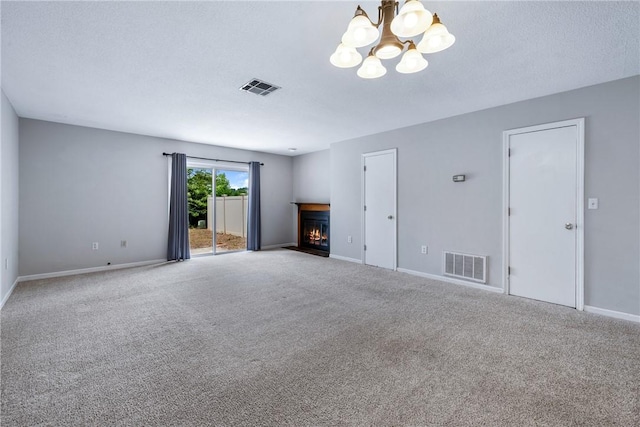 13036 W Camelia Ln, Seneca, SC 29678 - unfurnished living room featuring a chandelier, a lit fireplace, carpet floors, and baseboards