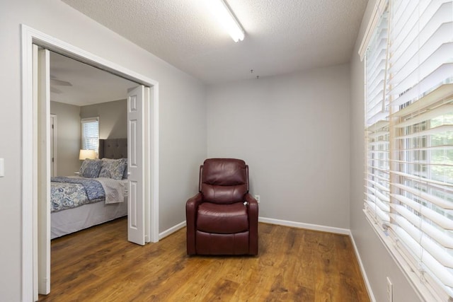 199 Mountain Rest Lake Rd, Mountain Rest, SC 29664 - sitting room featuring wood finished floors, baseboards, and a textured ceiling