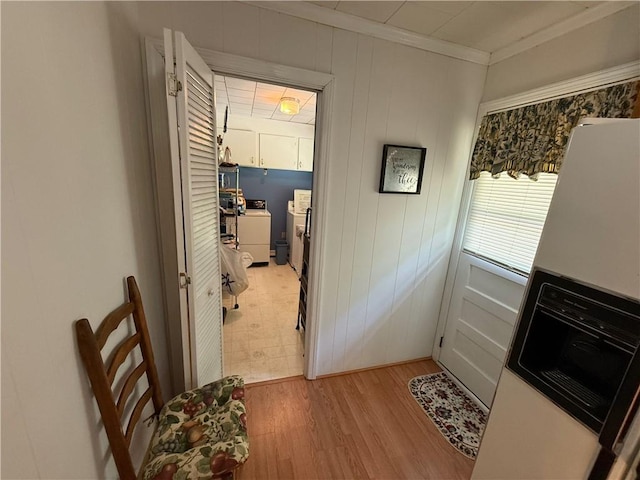 308 Oak Drive Ext, Honea Path, SC 29654 - doorway with washer / dryer, crown molding, and light wood finished floors