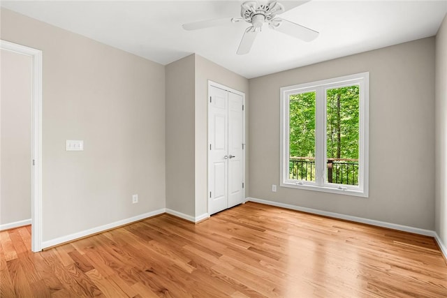 307 Warbranch Rd, Central, SC 29630 - unfurnished bedroom featuring baseboards, light wood-style flooring, ceiling fan, and a closet