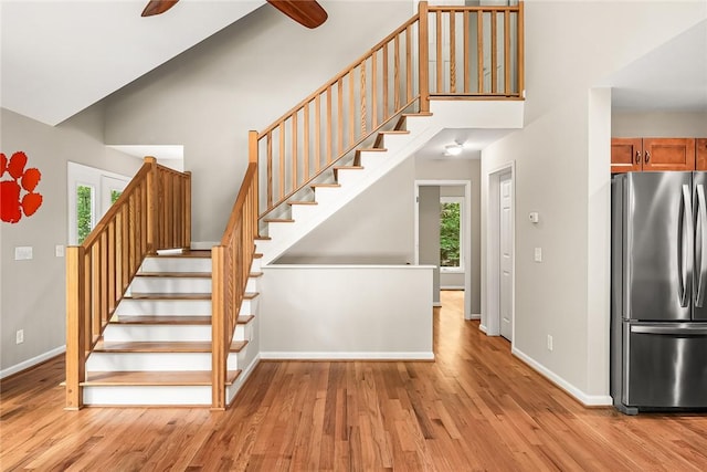307 Warbranch Rd, Central, SC 29630 - stairs featuring wood finished floors, a towering ceiling, a ceiling fan, and baseboards