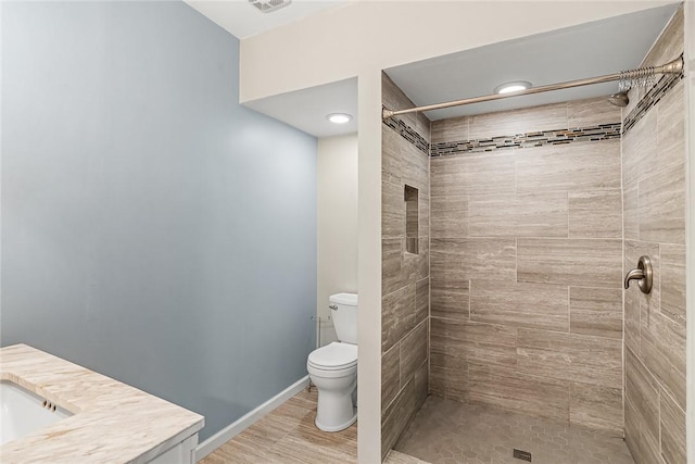307 Warbranch Rd, Central, SC 29630 - full bathroom featuring toilet, vanity, a tile shower, and baseboards