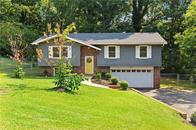 205 Fernwood Dr, Seneca, SC 29678 - split foyer home featuring an attached garage, asphalt driveway, a gate, and brick siding