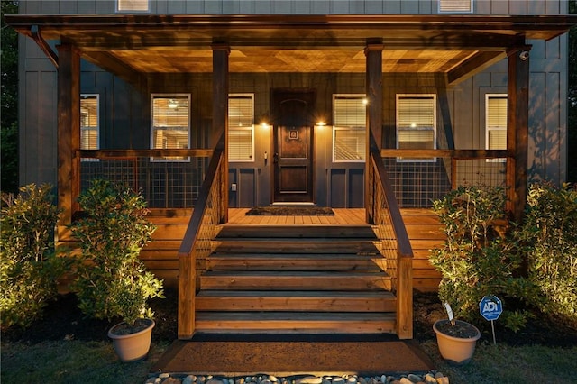 2000 Ridge Rd, Hartwell, GA 30643 - doorway to property with covered porch and board and batten siding