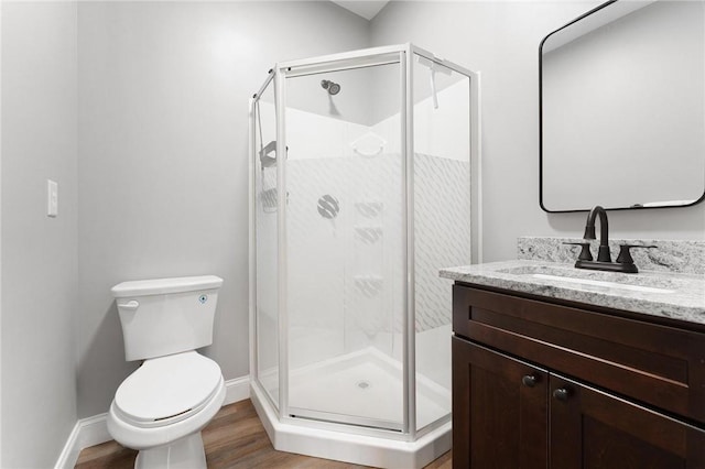 2000 Ridge Rd, Hartwell, GA 30643 - bathroom featuring toilet, vanity, a stall shower, and wood finished floors