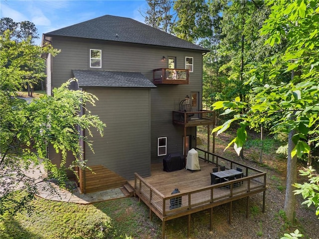 2000 Ridge Rd, Hartwell, GA 30643 - rear view of house featuring a balcony, a shingled roof, and a wooden deck