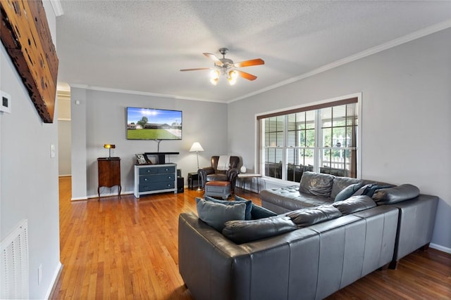 661 Playground Rd, Walhalla, SC 29691 - living room featuring a ceiling fan, wood finished floors, crown molding, and baseboards