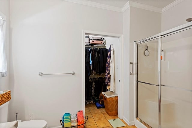 661 Playground Rd, Walhalla, SC 29691 - bathroom featuring a shower stall, ornamental molding, a walk in closet, toilet, and baseboards