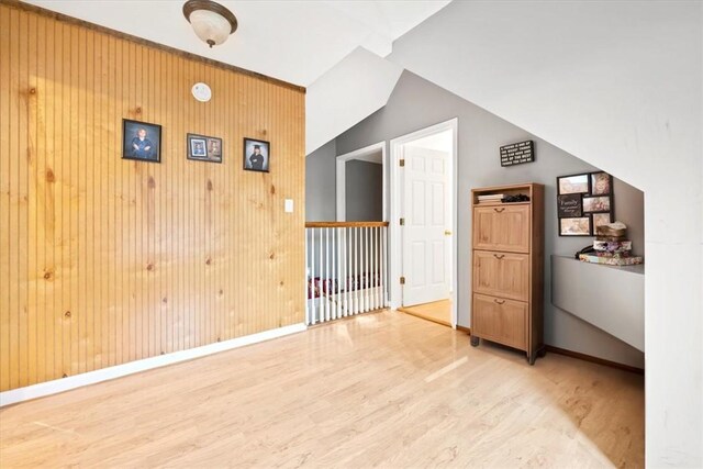151 Hannah Cir, Anderson, SC 29621 - empty room featuring light wood-style flooring, baseboards, wood walls, and lofted ceiling