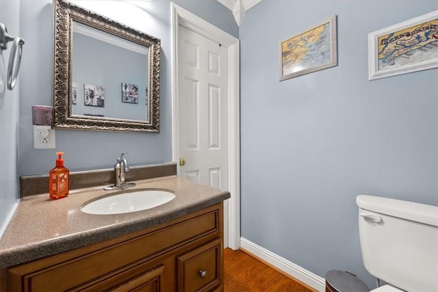 151 Hannah Cir, Anderson, SC 29621 - half bathroom featuring vanity, wood finished floors, toilet, and baseboards