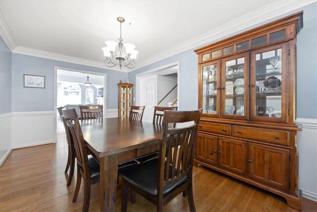 151 Hannah Cir, Anderson, SC 29621 - dining space with a chandelier, wood finished floors, a wainscoted wall, and crown molding