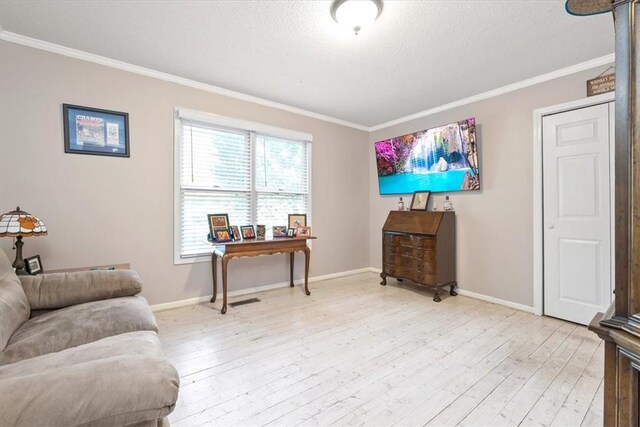 151 Hannah Cir, Anderson, SC 29621 - living area with crown molding, light wood finished floors, baseboards, and a textured ceiling