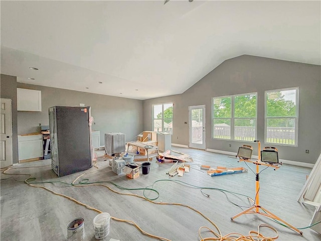 206 Highland Ave, Westminster, SC 29693 - living area with lofted ceiling, baseboards, and light wood-style floors