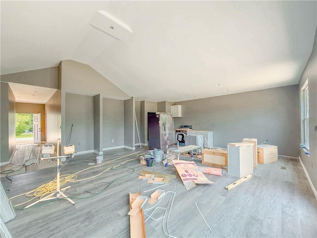 206 Highland Ave, Westminster, SC 29693 - living room with wood finished floors, vaulted ceiling, and baseboards