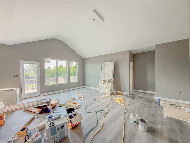 206 Highland Ave, Westminster, SC 29693 - unfurnished living room with vaulted ceiling, baseboards, and wood finished floors