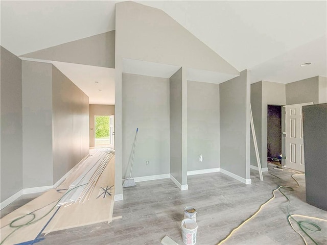 206 Highland Ave, Westminster, SC 29693 - spare room with baseboards, wood finished floors, and vaulted ceiling