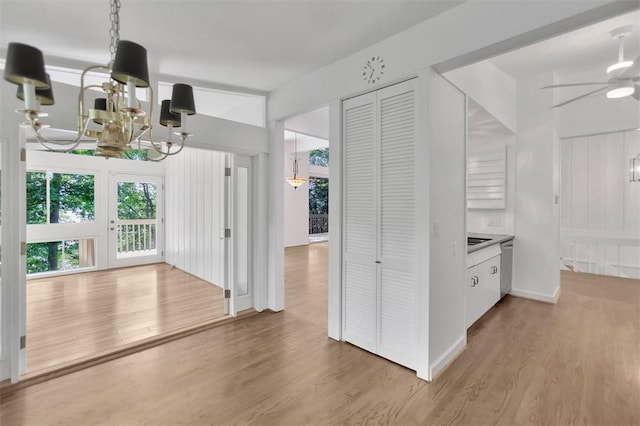 1613 S Arlington Dr, Seneca, SC 29672 - corridor with a chandelier, light wood-style floors, and baseboards