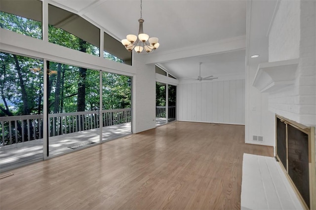 1613 S Arlington Dr, Seneca, SC 29672 - unfurnished living room with a chandelier, wood finished floors, healthy amount of natural light, and a large fireplace