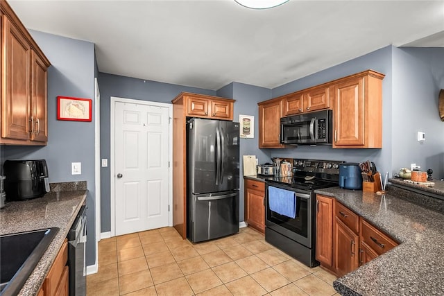 169 Campbell Bridge Rd, Seneca, SC 29678 - kitchen with freestanding refrigerator, stainless steel electric range, and dark countertops