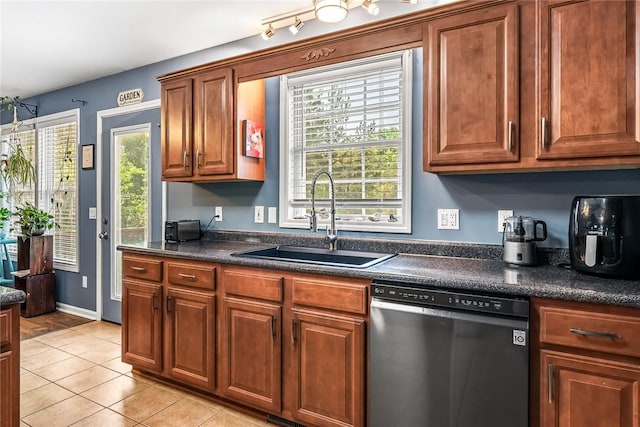169 Campbell Bridge Rd, Seneca, SC 29678 - kitchen featuring dishwasher, a sink, dark countertops, light tile patterned floors, and brown cabinets