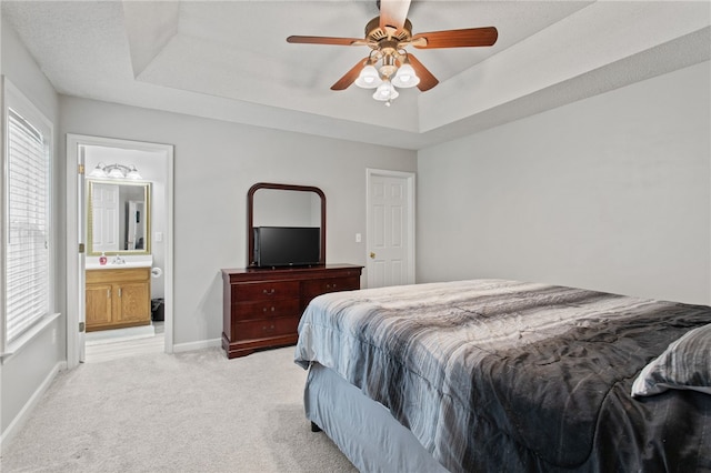 15 Laws Ln, Piedmont, SC 29673 - bedroom with a raised ceiling, light colored carpet, baseboards, ensuite bathroom, and a ceiling fan