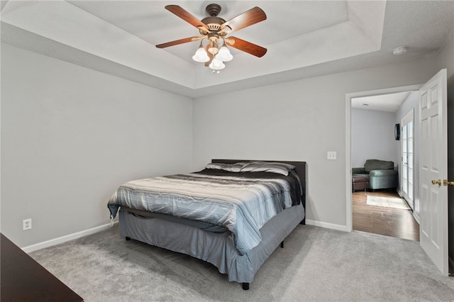 15 Laws Ln, Piedmont, SC 29673 - bedroom with carpet floors, a tray ceiling, baseboards, and a ceiling fan