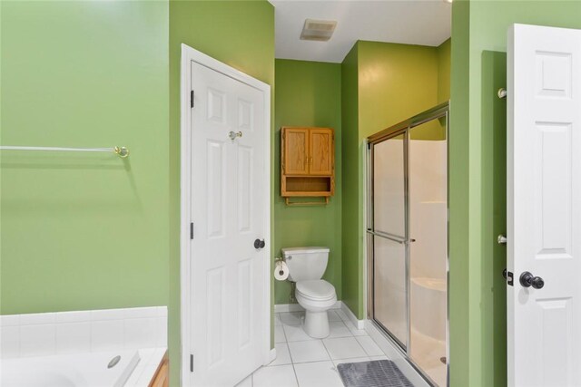 204 Lakeside Dr, Walhalla, SC 29691 - bathroom featuring tile patterned floors, a shower stall, toilet, and a bath
